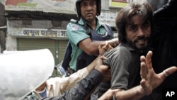 Police arrest an activist of the Bangladesh Nationalist Party (BNP) during a protest in Dhaka. A 48-hour countrywide strike called by the main opposition BNP and its ally Jamaat-e-Islami, a radical Islamist group, continues on Thursday, July 7, 2011