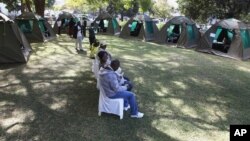 FILE: Members of the public wait to be tested for HIV and Aids in Harare, Zimbabwe, June, 22, 2012.