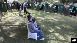 FILE: Members of the public wait to be tested for HIV and Aids in Harare, Zimbabwe, June, 22, 2012.