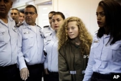 Ahed Tamimi is brought to a courtroom inside Ofer military prison near Jerusalem, Dec. 28, 2017.