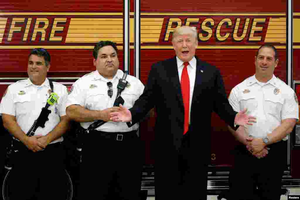 U.S. President Donald Trump greets members of the West Palm Beach Fire Rescue squads at one of their stations in West Palm Beach, Florida, U.S.