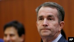 Virginia Gov. Ralph Northam prepares to address a news conference at the Capitol in Richmond, Va., Jan. 31, 2019. 