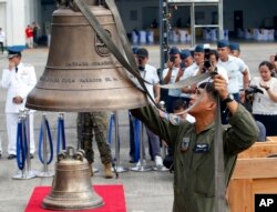Philippine Air Force personnel unload three church bells seized by American troops as war trophies more than a century ago, as they arrive in suburban Pasay city southeast of Manila, Philippines, Dec. 11, 2018.