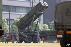 FILE - Japan Self-Defense Force members set up a PAC-3 Patriot missile unit deployed ahead of North Korea's planned rocket launch at the Defense Ministry in Tokyo, June 21, 2016.