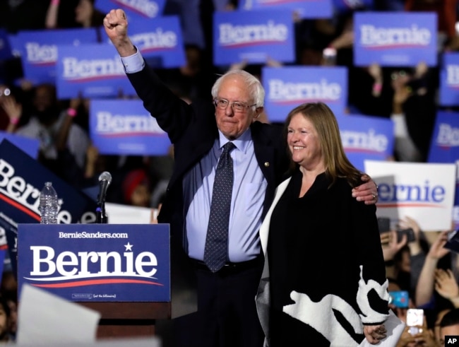 Sen. Bernie Sanders, I-Vt. (L) and his wife, Jane O'Meara Sanders, greet supporters as they leave after his 2020 presidential campaign stop at Navy Pier in Chicago, March 3, 2019.