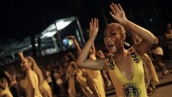 In this Jan. 27, 2020 photo, Rie Tanaka dances during a rehearsal of the Paraiso do Tuiuti samba school in Rio de Janeiro, Brazil. (AP Photo/Silvia Izquierdo)