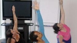 Yoga instructor Vionna Jones, center, leads Discovery Communications employees in an early morning fitness class at the media company's headquarters in Silver Spring, Maryland, in 2009