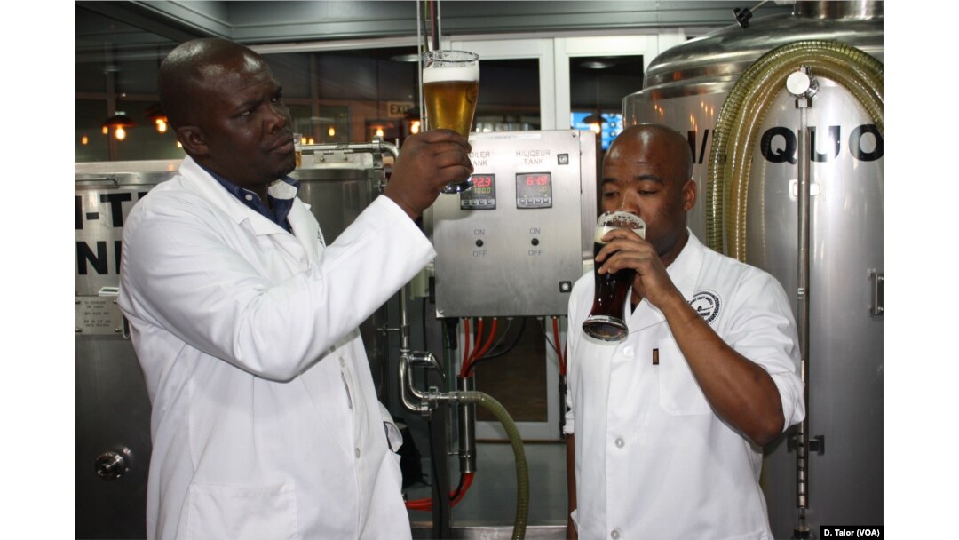Chief brewer Phumelelo Marali (left) and his trainee Sibusiso Khumalo check the quality of some of their beer inside Africa's first airport-based brewery at O.R. Tambo International, near Johannesburg, South Africa.