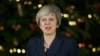 May Survives Confidence Vote, Fails to Tame Critics