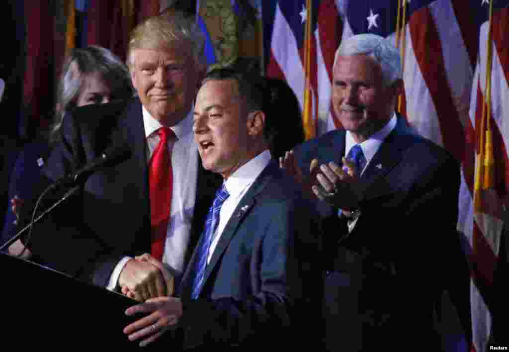 U.S. President elect Donald Trump shakes hands with Republican National Committee Chairman Reince Priebus (C) as Vice President-elect Mike Pence (R) looks onat election night rally in Manhattan, New York, Nov. 9, 2016. 