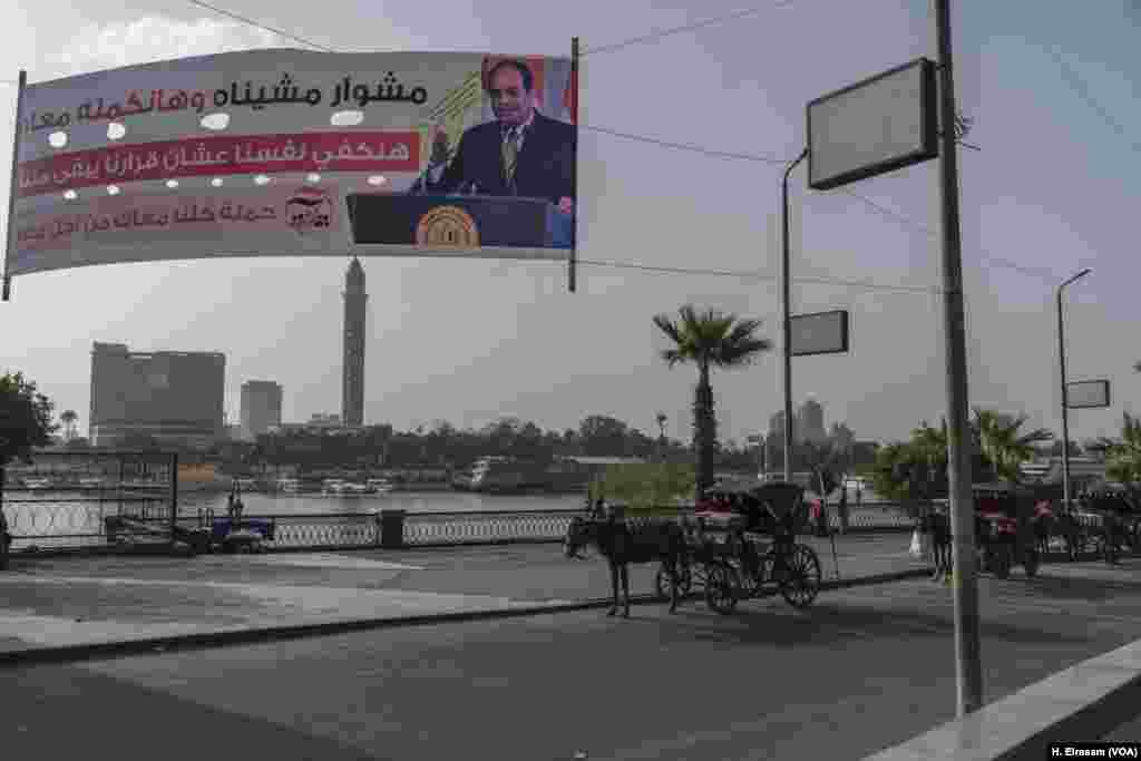 A campaign banner along the Nile urges voters to re-elect President Sissi in next month's elections. Ethiopia embarked on construction of the gigantic dam as Egypt was embroiled in the political turmoil of the 2011 revolution that toppled longtime ruler Hosni Mubarak.
