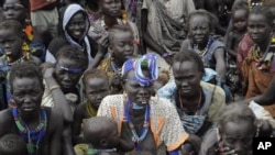 Victims of ethnic violence in Jonglei, state, South Sudan, wait in line at the World Food Program distribution center in Pibor, South Sudan to receive emergency food rations, January12, 2012.