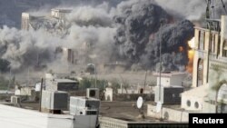 Smoke billows during an air strike on the Republican Palace in Yemen's southwestern city of Taiz April 17, 2015. 