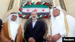 Mouaz al-Khatib (center) keynoted the Syrian opposition’s history-making March 27 premiere as the replacement in the League of Arab States for the troubled government of President Bashar al-Assad. 