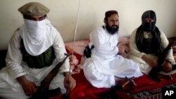 FILE - In this July 28, 2011 file photo, Taliban No 2 commander Waliur Rehman talks to the Associated Press during an interview in Shawal area of South Waziristan 