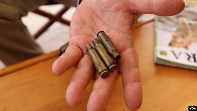 Martin Evans, owner of Ol Maisor ranch, shows shell casings he found on his property in Laikipia, Kenya, March 16, 2017. (J. Craig/VOA)