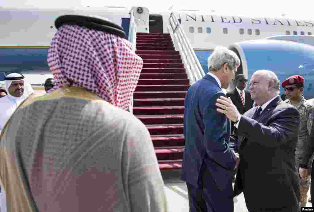 U.S. Secretary of State John Kerry (center) talks with Joseph W. Westphal, U.S. Ambassador to Saudi Arabia, before boarding his plane at King Abdulaziz International Airport in Jeddah, Sept. 12, 2014.&nbsp;