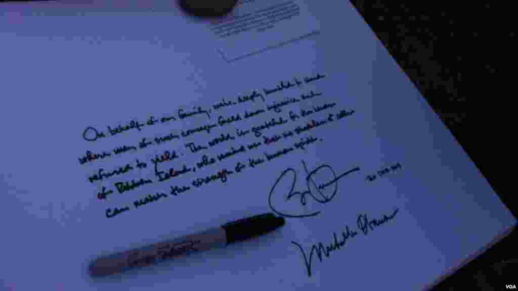 President Obama signing guest book at Robben Island prison in South Africa.