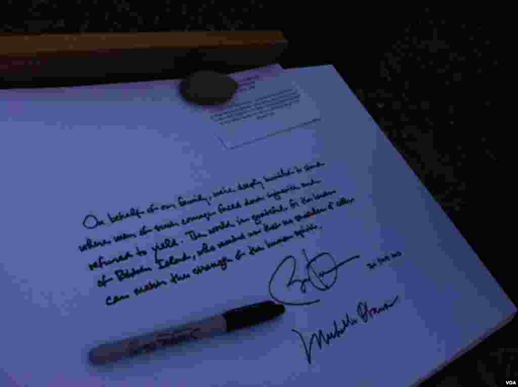 President Obama signing guest book at Robben Island prison in South Africa.