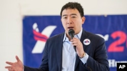 FILE - Andrew Yang, a candidate in the Democratic primaries for president, speaks at a town hall meeting in Cleveland, Feb. 24, 2019.