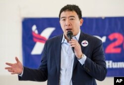 FILE - Andrew Yang, a candidate in the Democratic primaries for president, speaks at a town hall meeting in Cleveland, Feb. 24, 2019.