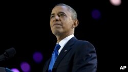 President Barack Obama pauses as he speaks at the election night party at McCormick Place in Chicago, early Wednesday, Nov. 7, 2012.