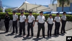 Police stand guard outside a private hospital where Guatemala's former Vice President Roxana Baldetti is being treated and where she was detained in connection with a customs corruption scandal in Guatemala City, Aug. 21, 2015.