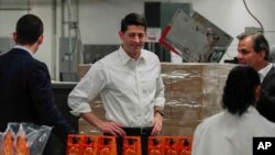 House Speaker Paul Ryan (C) tours a packaging facility in West Albany, Ohio, May 10, 2017. Ryan says "it's high time" to reform the nation's tax system, noting that its last overhaul took place in 1986.