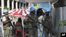 UN forces stand guard on a street in Abidjan, Ivory Coast, 22 Dec 2010.