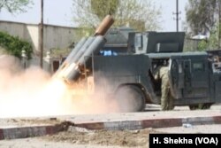 Iraqi forces fire at IS positions in Mosul, Iraq, March 29, 2017.