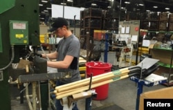 A production line employee works at the AMES Companies shovel manufacturing factory in Camp Hill, Pennsylvania, June 29, 2017.