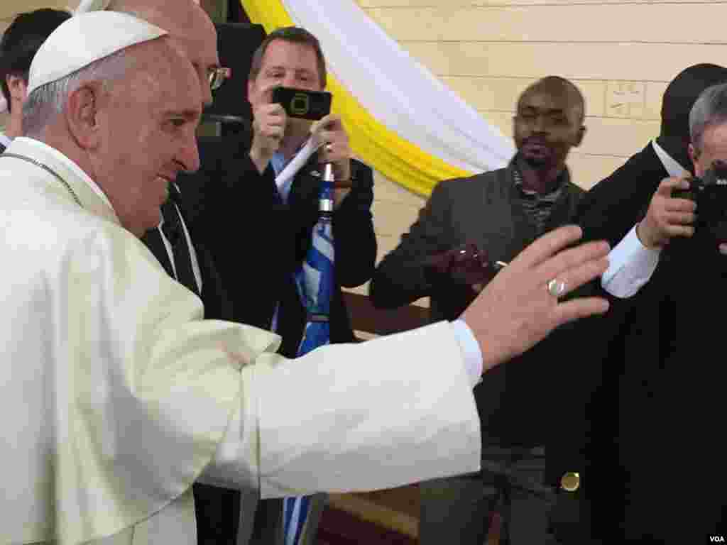 The Pope exiting the church after the event in Nairobi's Kangemi slum, Nov. 27, 2015. (J. Craig/VOA)