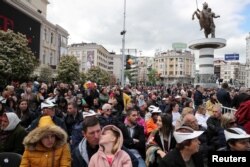 People wait for Pope Francis to arrive and lead the Holy Mass at the Macedonia square in Skopje, North Macedonia, May 7, 2019.