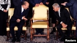 Israel's Prime Minister Naftali Bennett chats with Foreign Minister Yair Lapid ahead of a group photo with ministers of the new Israeli government, in Jerusalem June 14, 2021. (REUTERS/Ronen Zvulun)