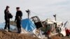 Workers Demolish Calais 'Jungle' Refugee Camp