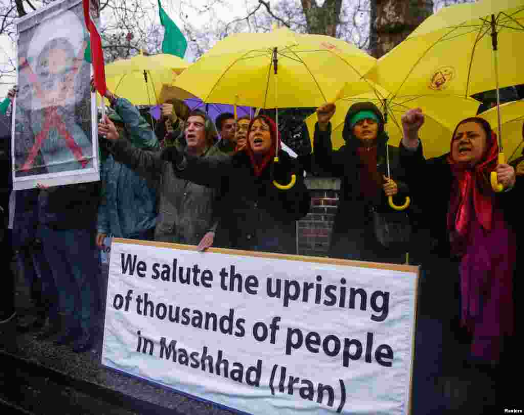 Opponents of Iranian President Hassan Rouhani hold a protest outside the Iranian embassy in west London, Dec. 31, 2017.