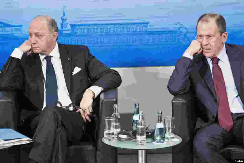 French Foreign Minister Laurent Fabius (L) and Russian Foreign Minister Sergey Lavrov attend the Munich Security Conference at the Bayerischer Hof Hotel in Munich, Germany.