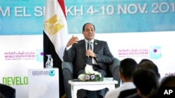 FILE - In this Nov. 7, 2017 photo, Egyptian President Abdel-Fattah el-Sissi participates in a meeting with a group of young people at the "World Youth Forum," a government-organized event in Sharm el-Sheikh, Egypt.