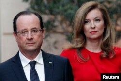 FILE - French President Francois Hollande (L) and his former-companion Valerie Trierweiler arrive for a state dinner at the Elysee Palace in Paris.