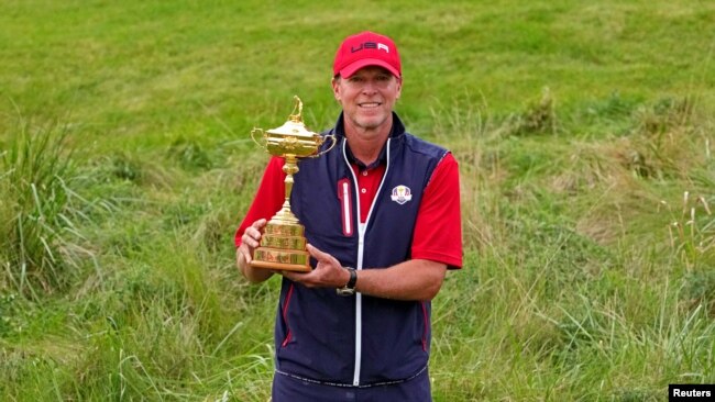 Team USA captain Steve Stricker poses with Ryder Cup after the United State beat Europe for the 43rd Ryder Cup golf competition at Whistling Straits, Sep 26, 2021.