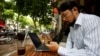 Vietnamese activist Anh Chi searches the internet at Tu Do (Freedom) cafe in Hanoi, Vietnam August 25, 2017. 