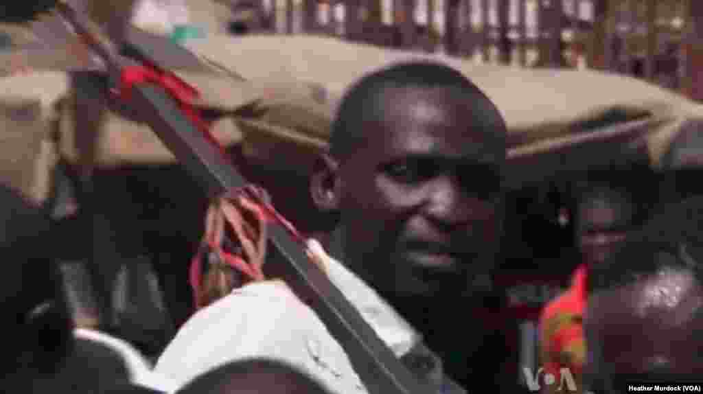 A member of the Civilian JTF with a homemade weapon in Maiduguri, Nigeria, December 2013. (Heather Murdock for VOA)