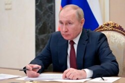 El presidente ruso, Vladimir Putin, asiste a una reunión del gabinete a través de una videoconferencia en el Kremlin en Moscú, Rusia, el 12 de enero de 2022.