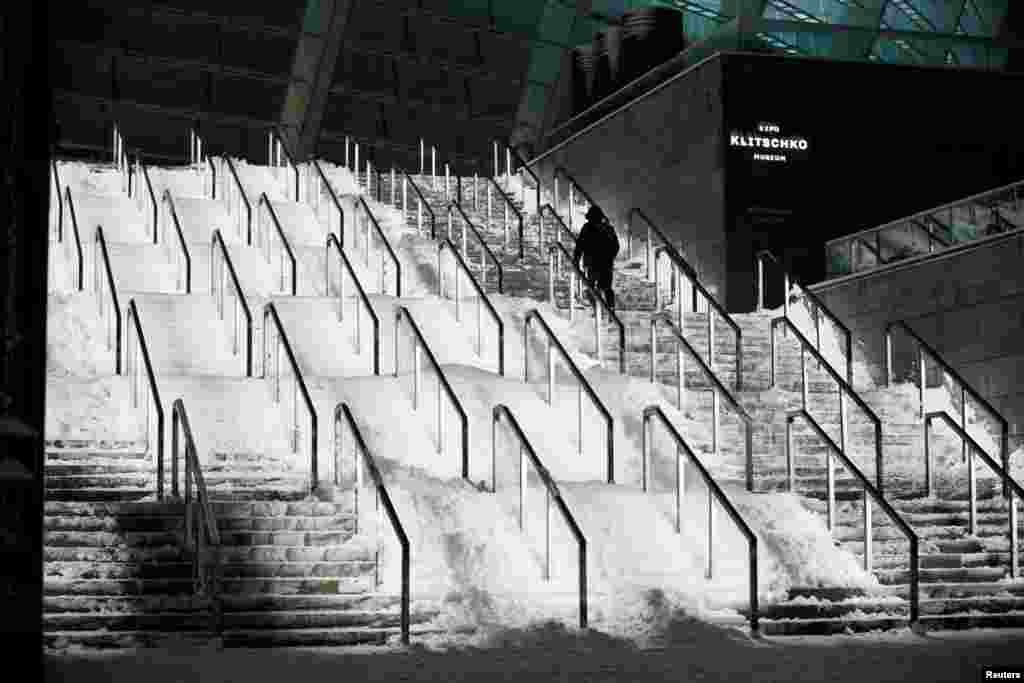 Steps are covered in snow outside the NSC Olimpiyskiy Stadium, Kyiv, Ukraine, Dec. 12, 2018.