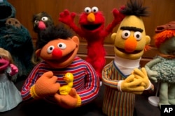 Bert and Ernie, as well as Elmo, center, are among a donation of additional Jim Henson objects to the Smithsonian's National Museum of American History in Washington, Sept. 24, 2013.
