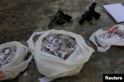 Drugs and guns seized from suspects arrested during violent clashes with Brazilian Army soldiers in Rio de Janeiro, Brazil, Aug. 20, 2018.