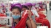 FILE PHOTO - Garment workers sew clothes in a factory as they wait for a visit by Prime Minister Hun Sen outside of Phnom Penh, Cambodia, Wednesday, Aug. 30, 2017. (AP Photo/Heng Sinith)