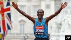 FILE - Eliud Kipchoge of Kenya wins the Men's race in the 35th London Marathon. Saturday he finished 25 seconds short of a sub-two-hour marathon.