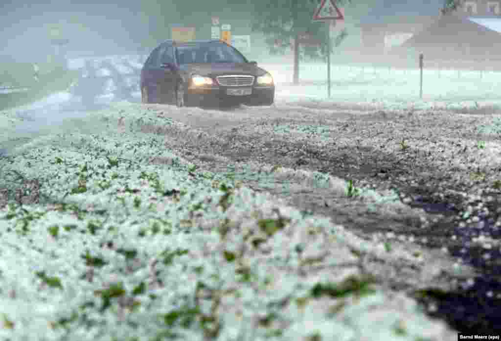 Hail covers a road after heavy storms hit Eibenstock, Germany.