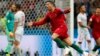 Portugal's Cristiano Ronaldo celebrates after he scored his third goal with a free kick during a group B draw, 3-3, with Spain at the 2018 World Cup in the Fisht Stadium in Sochi, Russia, June 15, 2018. 